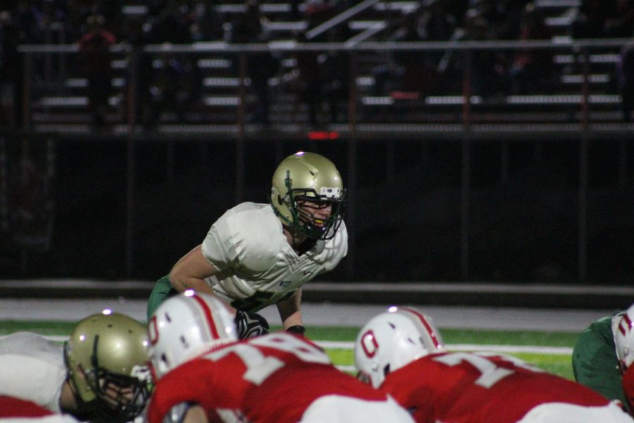 Caden Fedeler '18 waits for Ottumwa to snap the ball on Friday, Oct. 20.