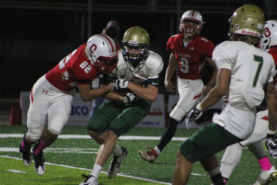 Austin West '18 brings the ball further up the field for the Trojans on Friday, Oct. 20.