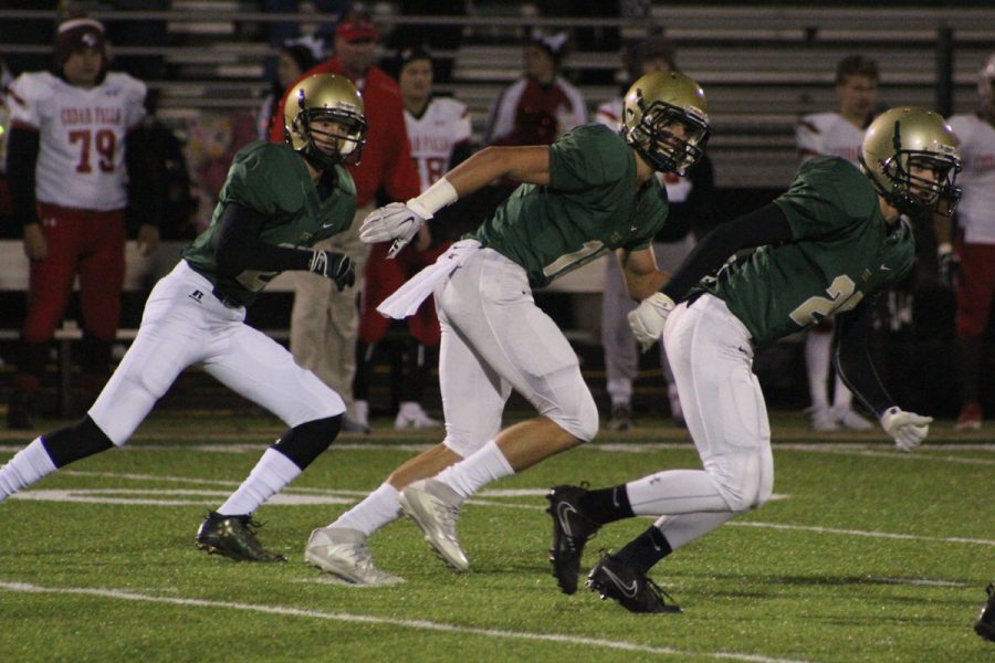 Quinn Foerstner '18, Cole Mabry '19 and Jackson Steburg '18 start running during a Trojan kickoff on Friday, Nov. 3.