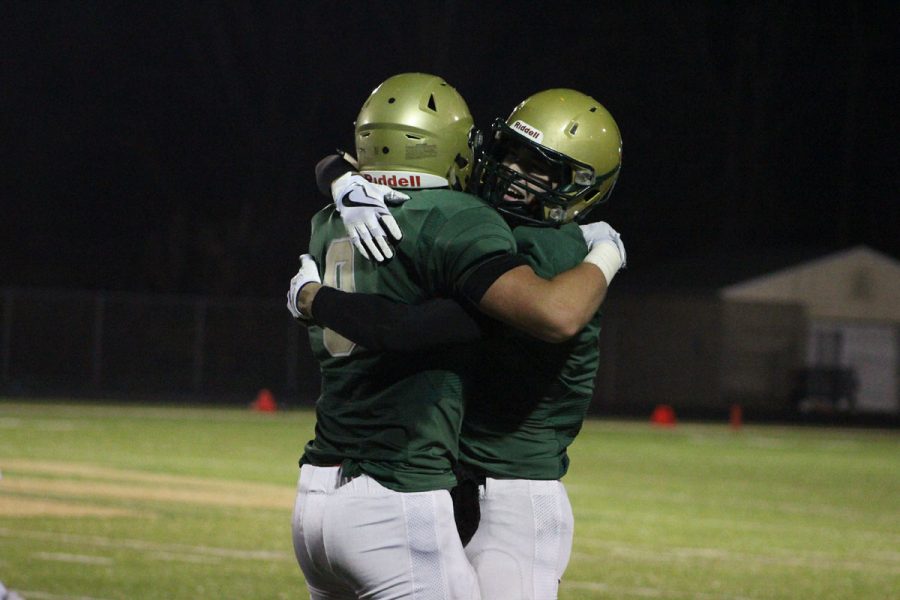 Austin Geasland '18 hugs Dillon Doyle '18 at the end of the game on Friday, Nov. 3.