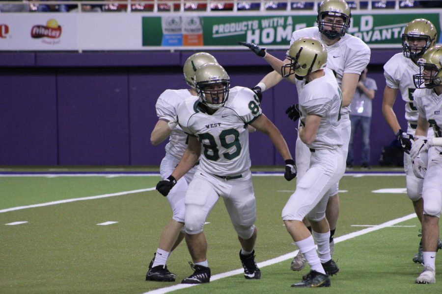 Will Hoeft '20 celebrates after he tackled a player from Bettendorf during a punt return on Friday, Nov. 10.