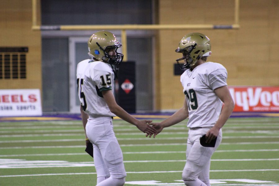 Josh Jasek '19 gives Lucas Karwal '18 a high five after Karwal had a good kick on Friday, Nov. 10.