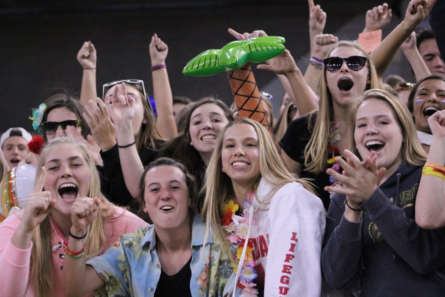 The students section cheers for a TV camera on Friday, Nov. 10.