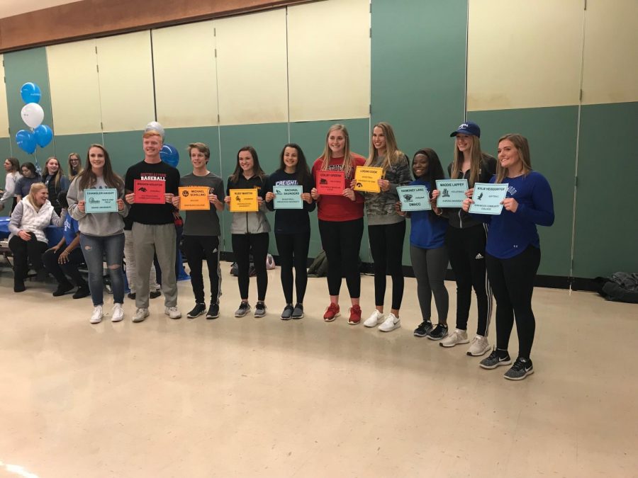 Seniors+pose+together+after+signing+their+National+Letters+of+Intent+on+Wed.%2C+Nov.+8.+From+left+to+right%3A+Chandler+Haight+18%2C+Braden+Houston+18%2C+Michael+Schilling+18%2C+Ruby+Martin+18%2C+Rachael+Saunders+18%2C+Colby+Greene+18%2C+Logan+Cook+18%2C+Keimoney+Lang+18%2C+Maddie+Laffey+18+and+Kylie+Heisdorffer+18.