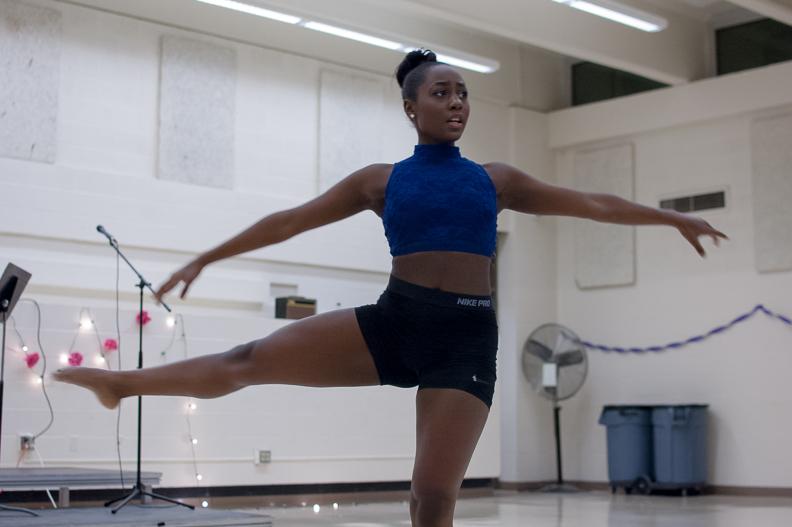 Sandrah Ochola 19 performs a dance to Audra Days Rise Up on Dec. 8 in the cafeteria. 