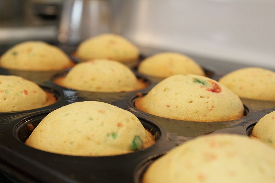 The muffins come out of the oven with a nice golden-brown color.  To check if they're done, stick a toothpick into the muffins, if it comes out clean, they're ready, if not, put them back into the oven for a couple more minutes.