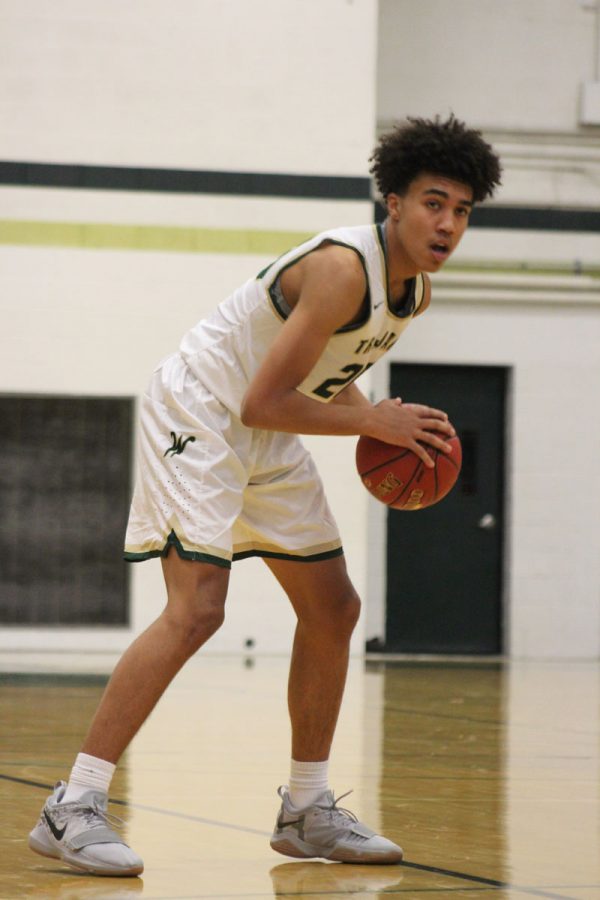 Dadrian Hoambrecker '18 holds the ball as he looks for a pass on Thursday, Nov. 30. 