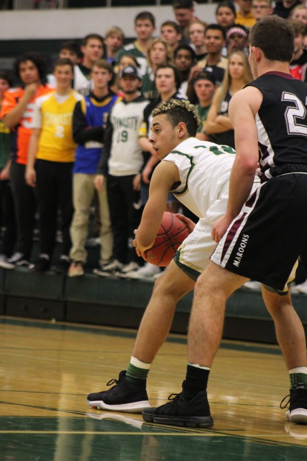 Jake Anderson '18 blocks out a Dowling player as he looks for a pass on Thursday, Nov. 30.