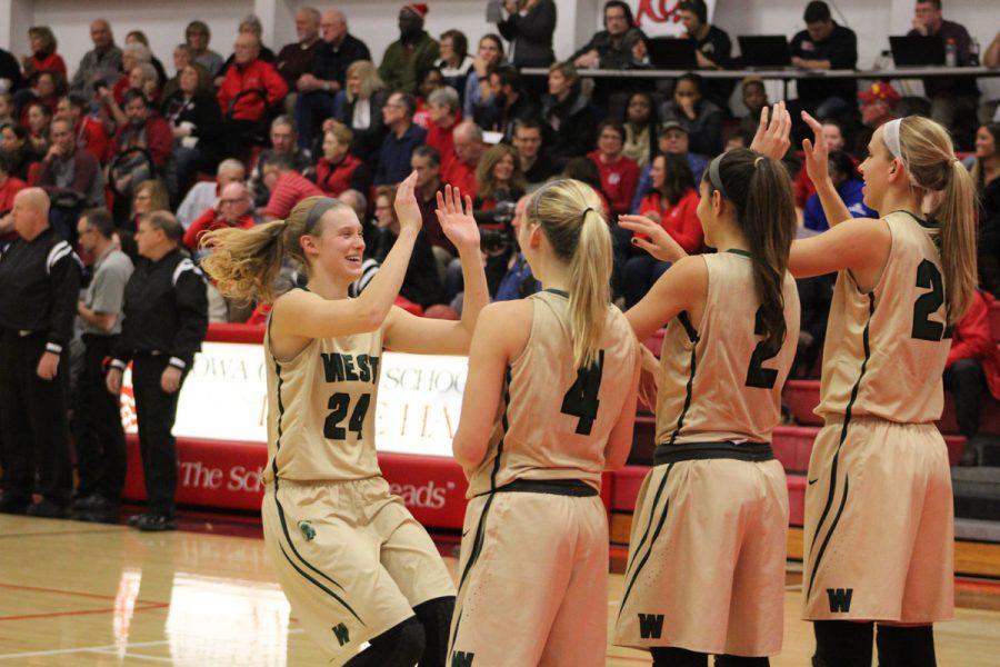 Emma Koch '19 claps hands with the rest of the starters as they get announced on Tuesday, Dec. 12.