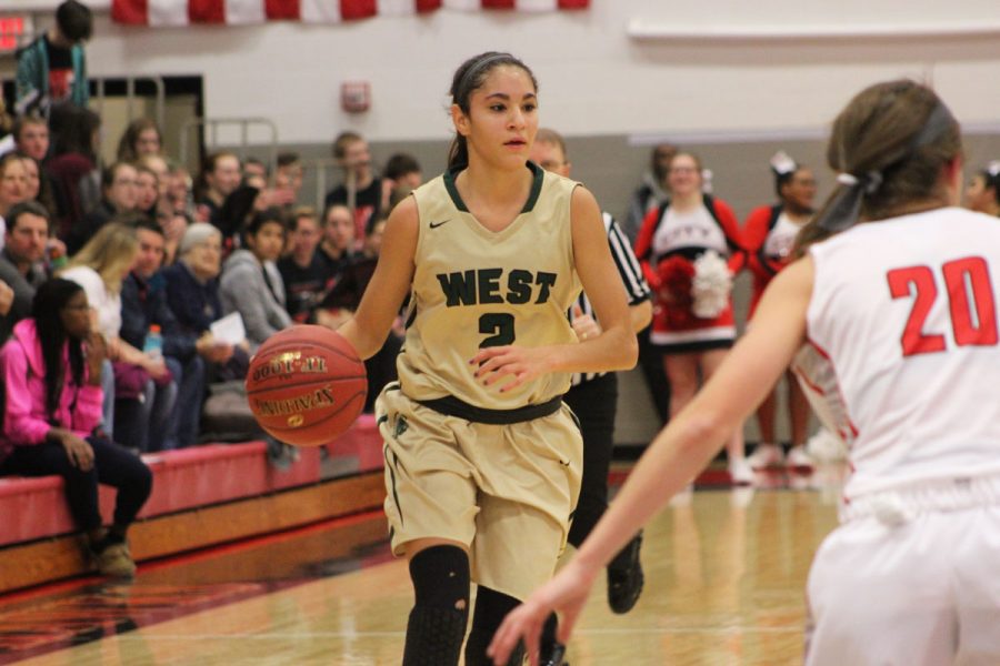 Cailyn Morgan '19 dribbles the ball as City's 	Ella Cook '21 gets ready to guard her on Tuesday, Dec. 12.