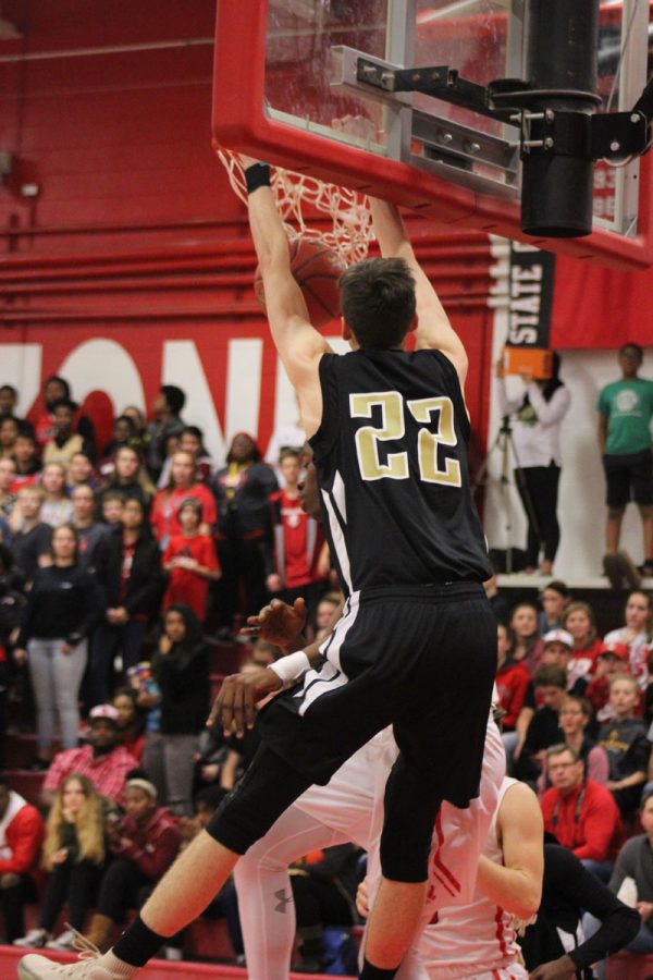 Patrick McCaffery '19 dunks the ball during the first quarter of the game on Tuesday, Dec. 12.