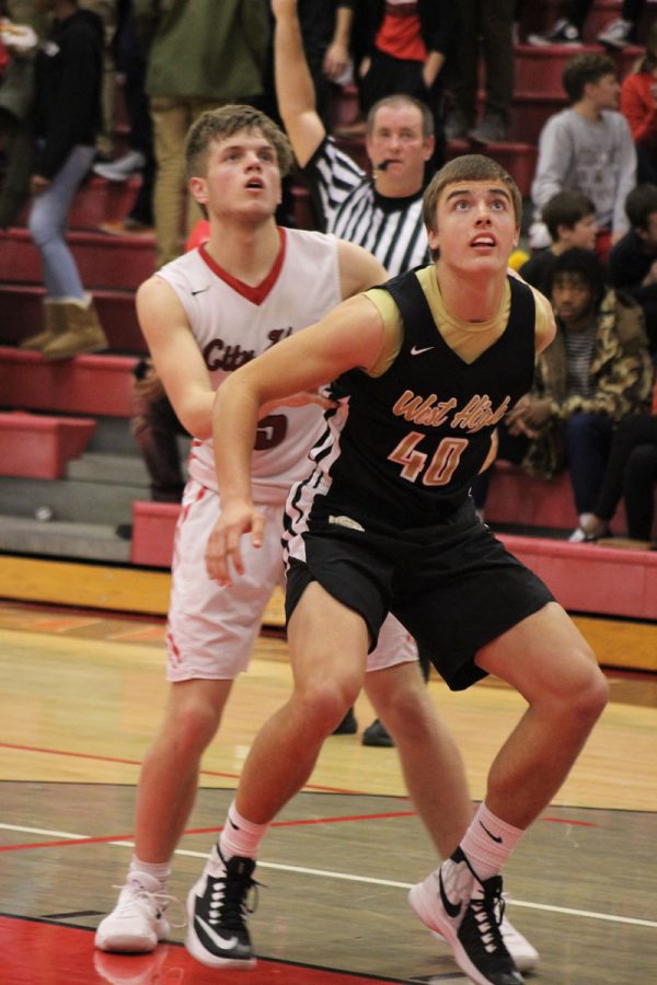 Cole Mabry '19 blocks out City's Luke Young '19 as they watch the ball go in after a City free throw on Tuesday, Dec. 12.