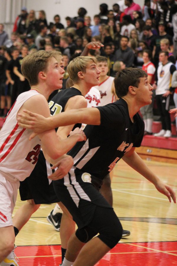 Jalen Gaudet '19 blocks out City's Ry Threlkeld-Weigand '19 on Tuesday, Dec. 12.