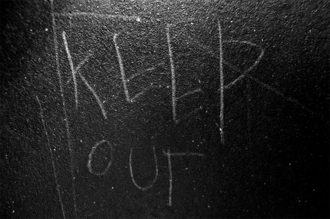 Sketched on the inside padded wall of a seclusion room at Northwest Junior HIgh reads the warning message, KEEP OUT. Also found along the walls of the seclusion room were footprints, scratch marks and unidentifiable bodily fluids. 