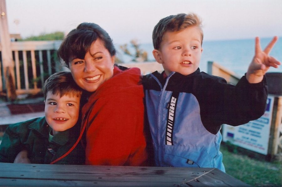 The brothers and their mother Valerie count down the seconds until the sun sets and hits the ocean in Florida.