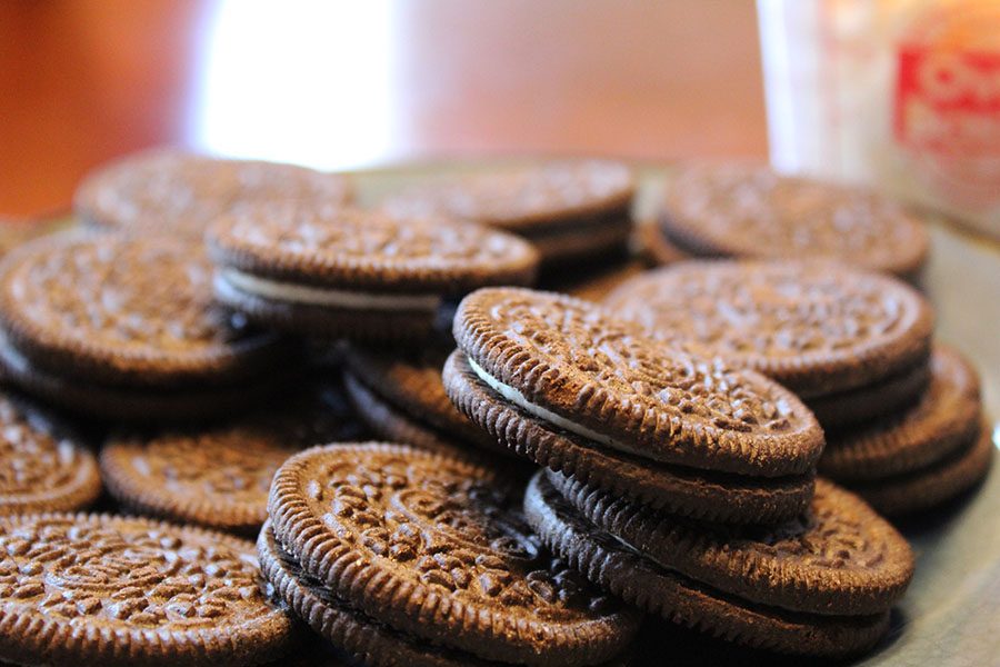 To begin, place the Oreos into a zip-lock plastic bag and crush them up, then mix them in with the measured cream cheese. 