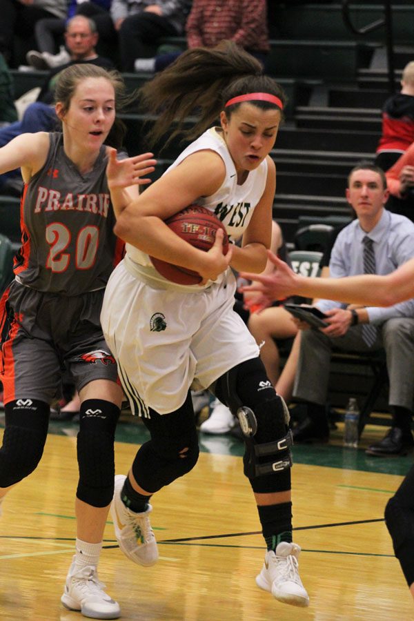 Rachael Saunders '18 protects the ball from Prairie's Rachael Kilpatrick '19, as she drives towards the basket on Friday, Jan. 19.