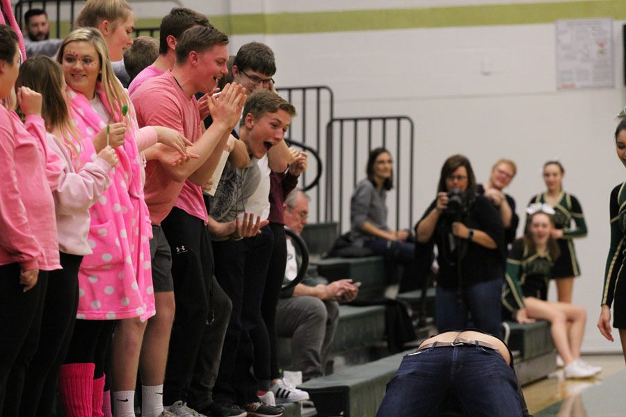 The student section laughs and cheers as Joe Briddle '18 does the bridge during a timeout on Friday, Jan. 19.