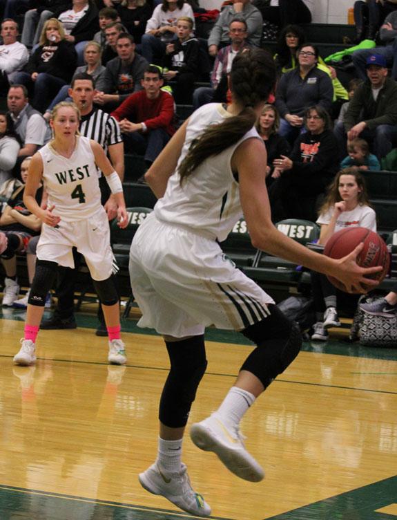 Lauren Zacharias '19 calls for the ball while Cailyn Morgan '19 tries to save it from going out of bounds on Friday, Jan. 19.