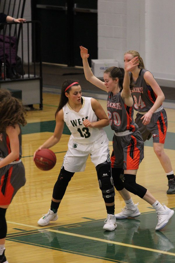 Rachael Saunders '18 tries to dribble around Prairie's Rachael Kilpatrick '19 on Friday, Jan. 19.