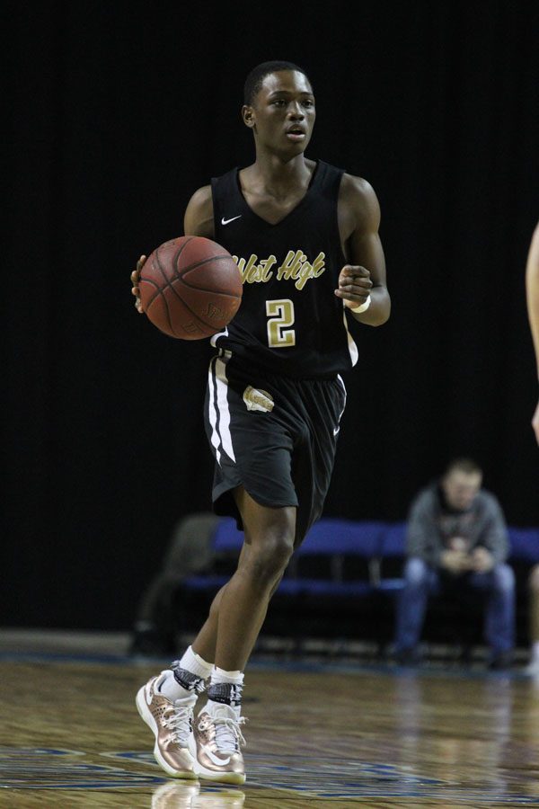 Dante Eldridge '19 dribbles the ball during the first quarter of the game on Saturday, Jan. 20.