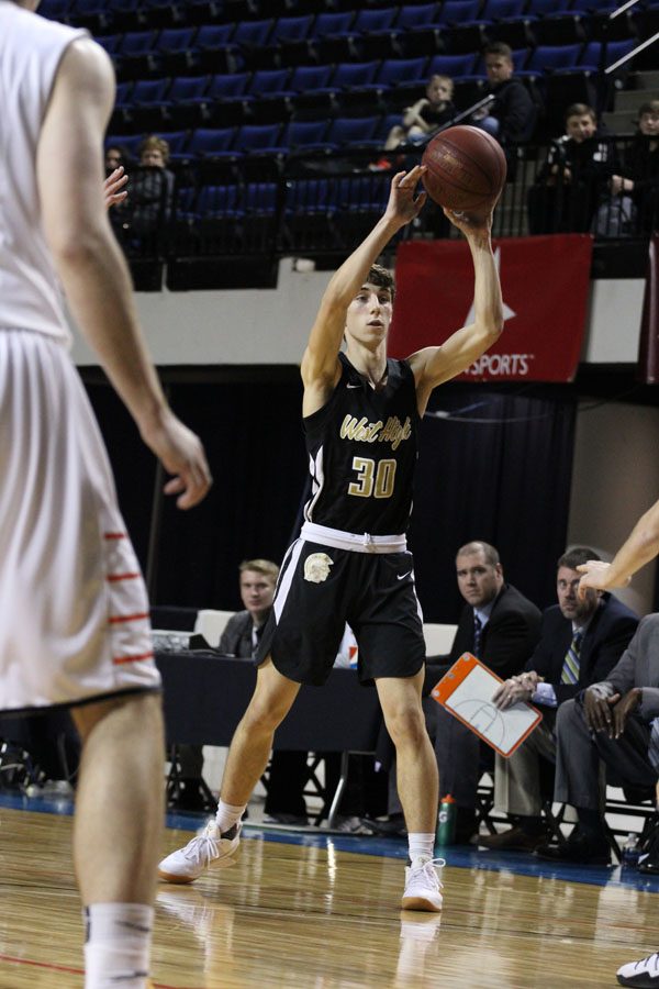 Brayden Adcock '19 passes the ball during the first half of the game on Saturday, Jan. 20.