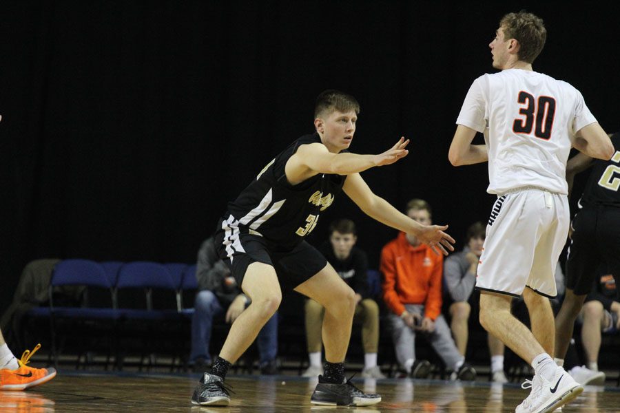 Jayson Barnes '18 guards Prairie's Harrison Cook '19 during the first half of the game on Saturday, Jan. 20.