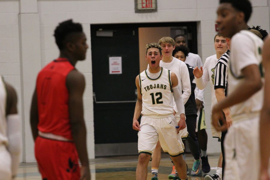 Jake Anderson 18 celebrates after Jayson Barnes 18 shot a 3-pointer and made the score 40-19 on Tuesday, Jan. 23.