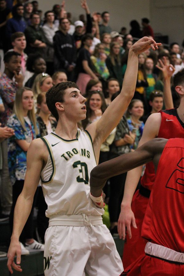 Brayden Adcock '19 watches his shot during the first half of the game on Tuesday, Jan. 23.