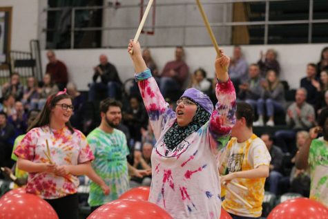 Hafiza El-Zein 19 holds her drum sticks in the air after she performed in the Best Buddies and PALS halftime show on Friday, Jan. 26.