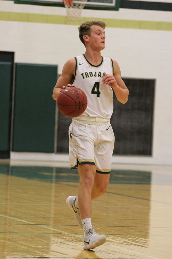 Evan Flitz '18 dribbles the ball down the court in the first quarter on Tuesday, Jan. 30.