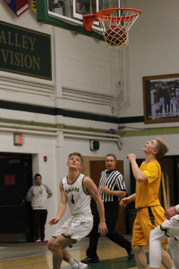 Evan Flitz '18 looks back as he watches the ball go in the hoop after he shot a layup on Tuesday, Jan. 30.