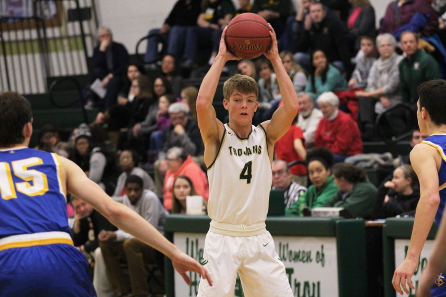 Evan Flitz '18 looks to find an open player from West to pass the ball to on Friday, Jan. 5.