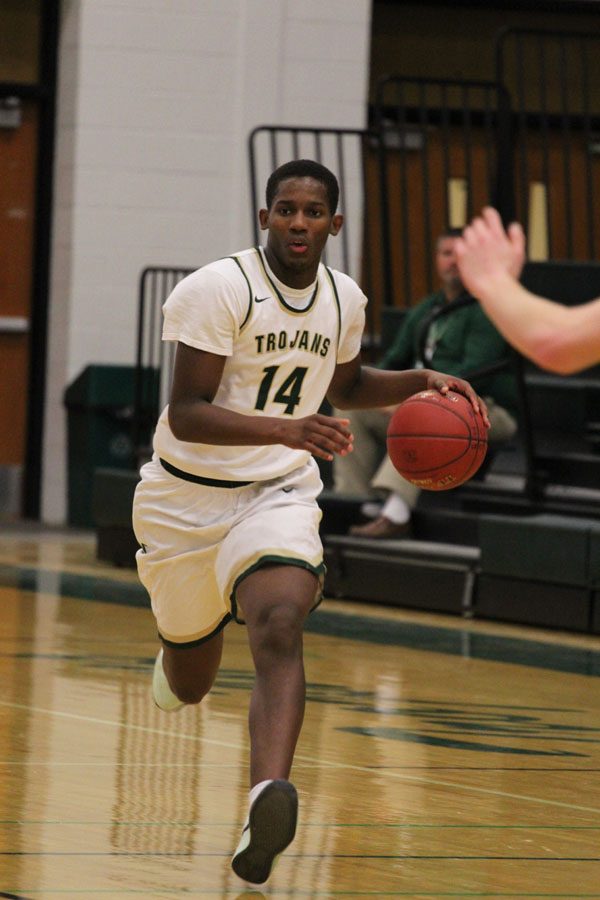 Hakeem Odunsi '18 dribbles the ball down to West's basket during the second half on Friday, Jan. 5.