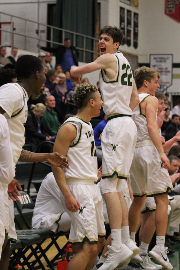 The team celebrates after TJ Hillberry '18 shoots a three pointer on Friday, Jan. 5.