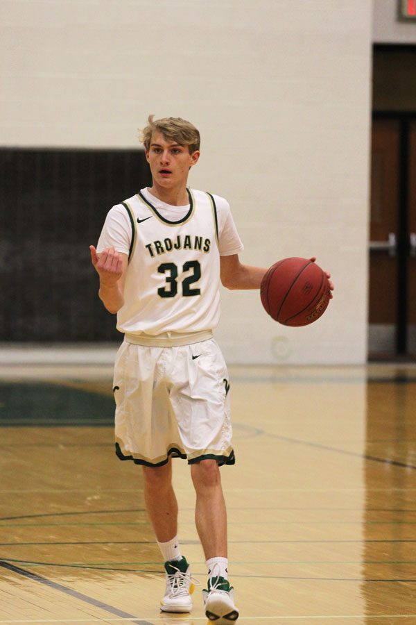 Jacob Klein '19 brings the ball down the court and motions to the West players on the court to move closer to him on Friday, Jan. 5.