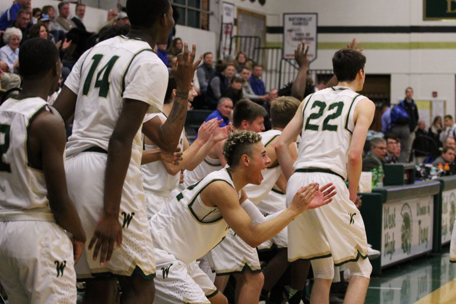 The team celebrates after West scored a three points on Friday, Jan. 5.