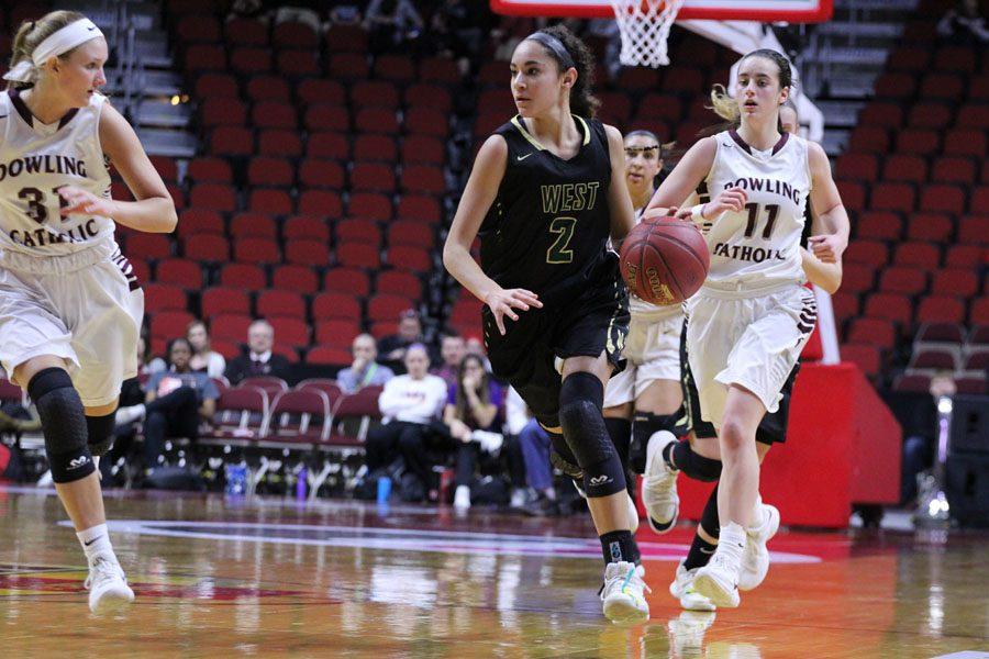 Cailyn Morgan '19 brings the ball down the court during the second half of the game on Monday, Feb. 26.