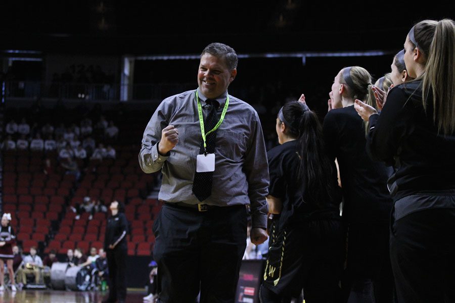 Head coach BJ Mayer celebrates after West secured the win on Monday, Feb. 26.