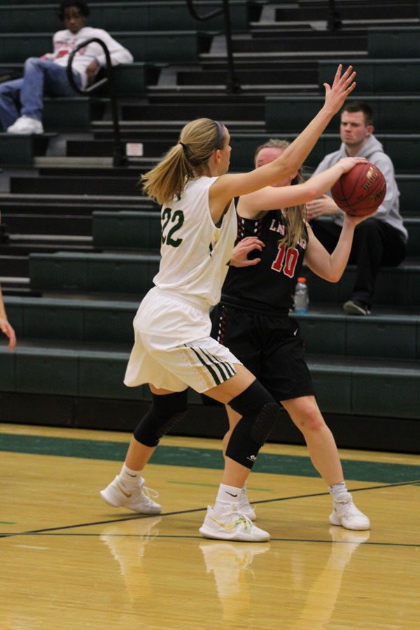 Logan Cook '18 presses Linn-Mar's Ally Johnson '18 during the third quarter on Tuesday, Feb. 6.