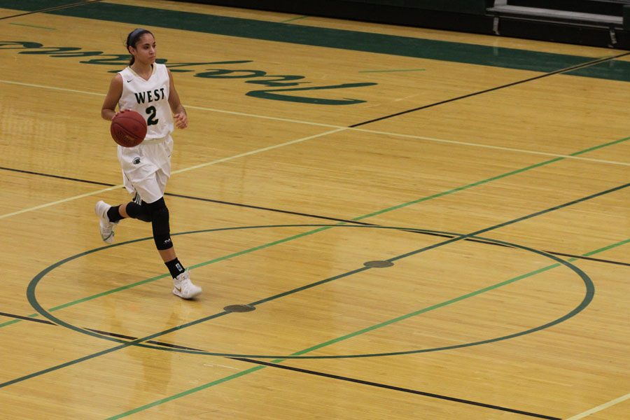 Cailyn Morgan '19 brings the ball down during the third quarter on Tuesday, Feb. 6.