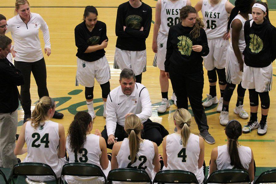 Coach BJ Mayer talks to the players during the break between the third and fourth quarters on Tuesday, Feb. 6.