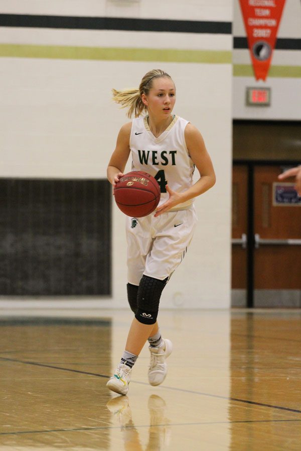 Lauren Zacharias '19 gets ready to pass the ball during the second half of the game on Friday, Feb. 9.