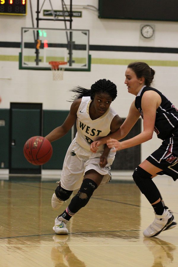 Matayia Tellis '21 drives toward the basket during the second half of the game on Friday, Feb. 9.