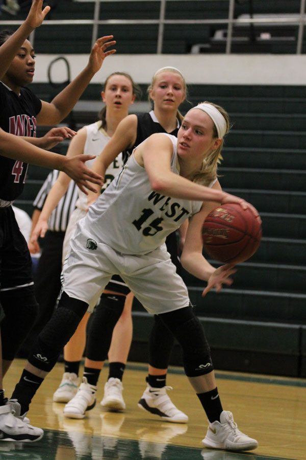 Carrie Callahan '18 tries to keep the ball in-bounds during the second half of the game on Friday, Feb. 9.