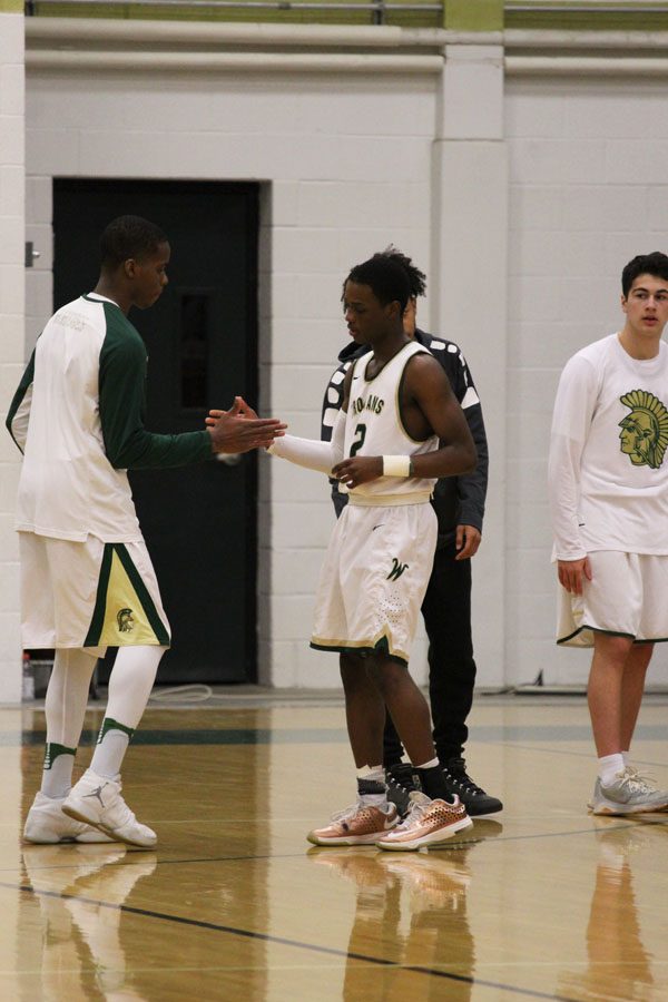 Marsean Rhodes '18 and Dante Eldridge '19 do their handshake before the game on Saturday, Feb. 17.