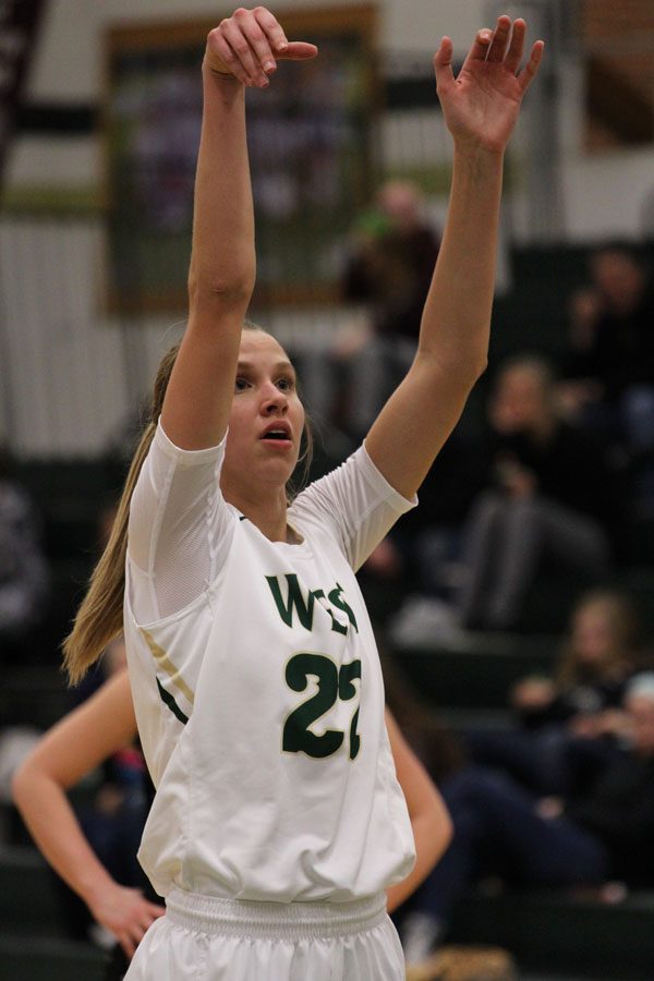 Logan Cook '18 shoots two free throws during the second half of the game on Saturday, Feb. 17.