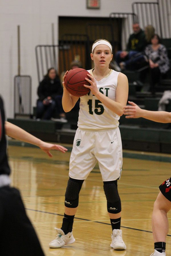 Carrie Callahan '18 looks for a fellow Trojan to pass the ball to during the fourth quarter on Saturday, Feb. 17.