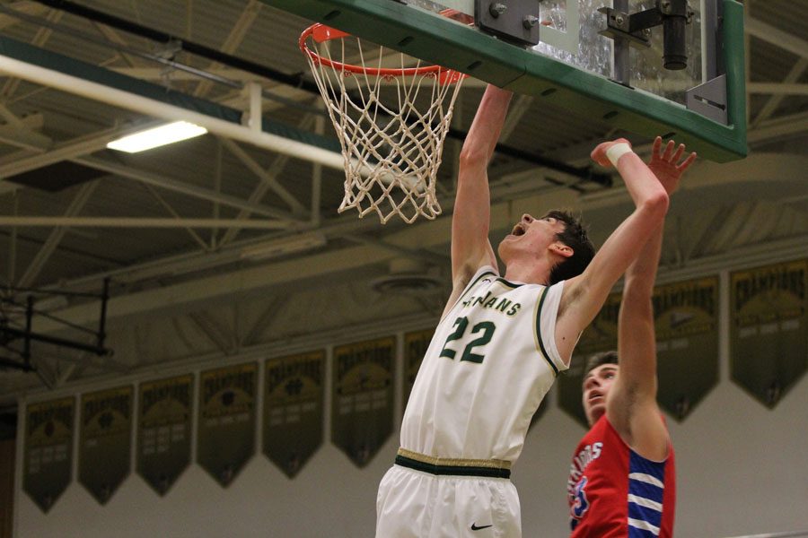 Patrick McCaffery '19 goes up for a basket as a player from Cedar Rapids Washington tries to defend it on Friday, Feb. 23.