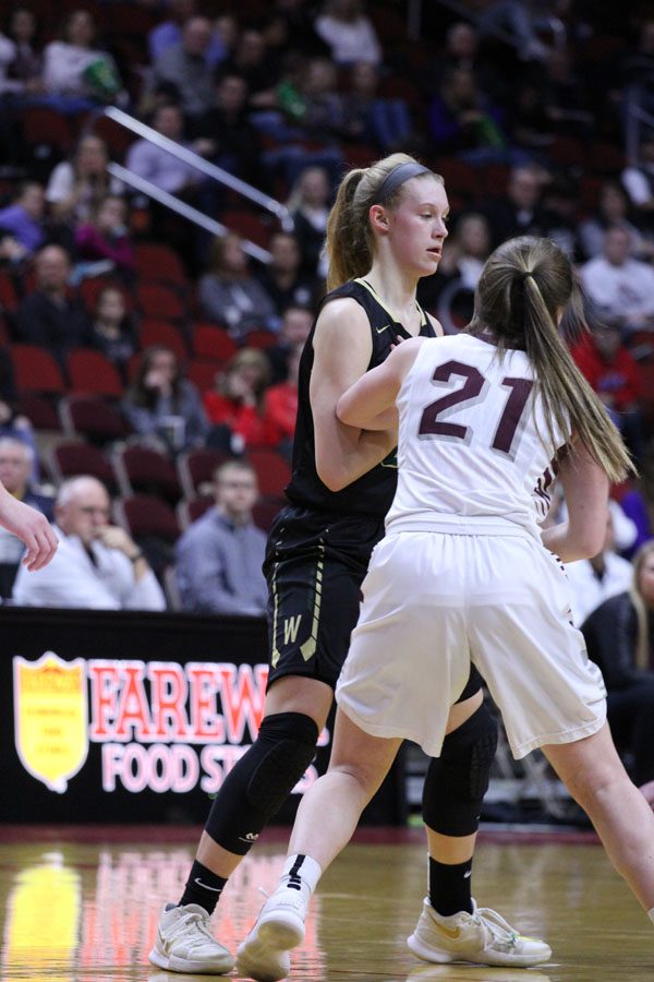 Emma Koch '19 blocks Dowling's Mia Cataldo '18, so West's Rachael Saunders '18 can get around her on Monday, Feb. 26.